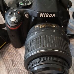 Nikon DSLR with Black and Red Accents